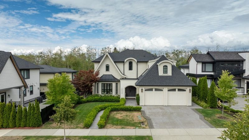 A luxury villa-style house with landscaped garden